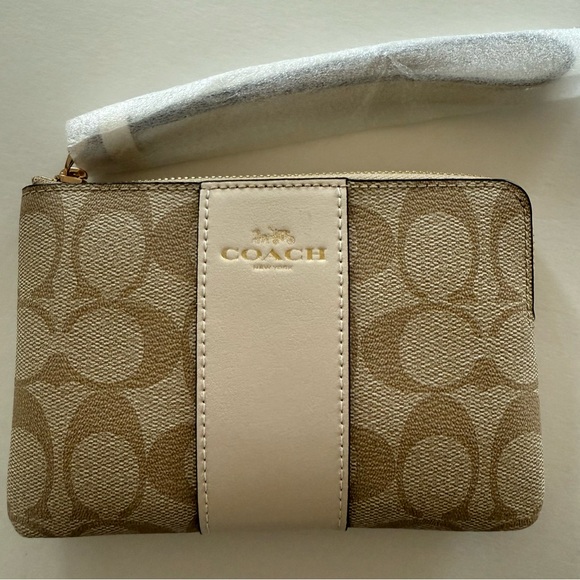 Coach Handbags - Coach Cream and Tan Wristlet